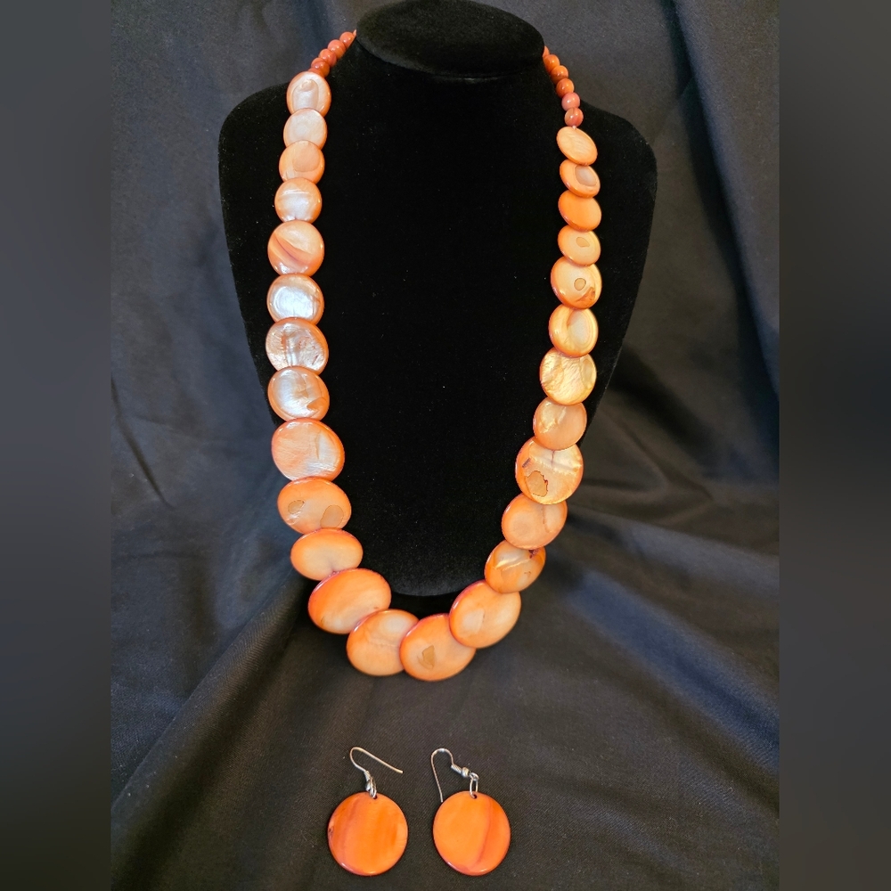 Retro Y2K–inspired orange and cream swirl beaded necklace with matching earrings